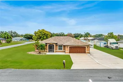 401 Candlewick Cir E, Lehigh Acres, FL 33936 - Photo 1