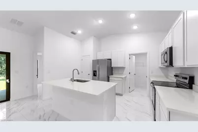 1051 Sentinela Blvd, Lehigh Acres, FL 33974 - Photo 11