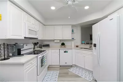 25080 Peacock Ln #101, Naples, FL 34114 - Photo 17