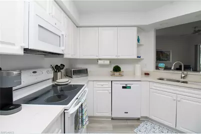25080 Peacock Ln #101, Naples, FL 34114 - Photo 21