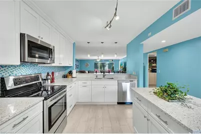 3072 Sandpiper Bay Cir #M204, Naples, FL 34112 - Photo 1