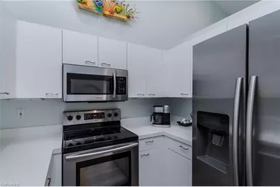56 Silver Oaks Cir #202, Naples, FL 34119 - Photo 13
