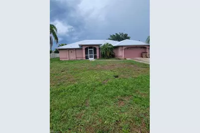 311 Inman St, Lehigh Acres, FL 33936 - Photo 1