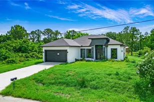 739 David Laird Ln, Lehigh Acres, FL 33974 - Photo 1