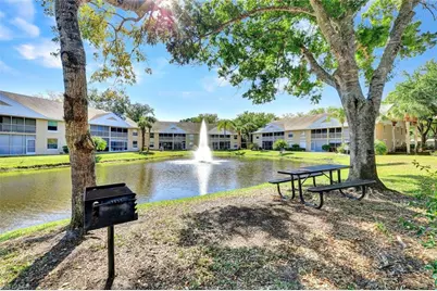 120 Pebble Shores Dr #205, Naples, FL 34110 - Photo 1