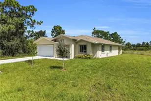 875 Cervantes St E, Lehigh Acres, FL 33974 - Photo 1