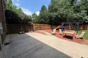 180 Village Green Ct SW, Lilburn, GA 30047 - Photo 1