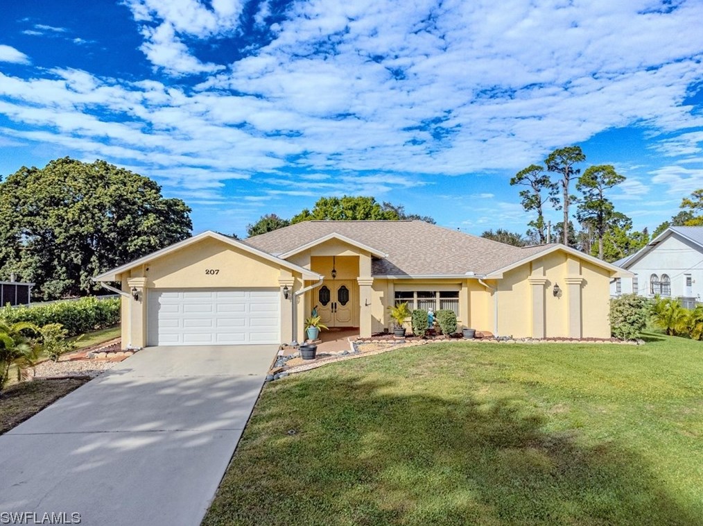 207 Lincoln Ave, Lehigh Acres FL  33936-1454 exterior