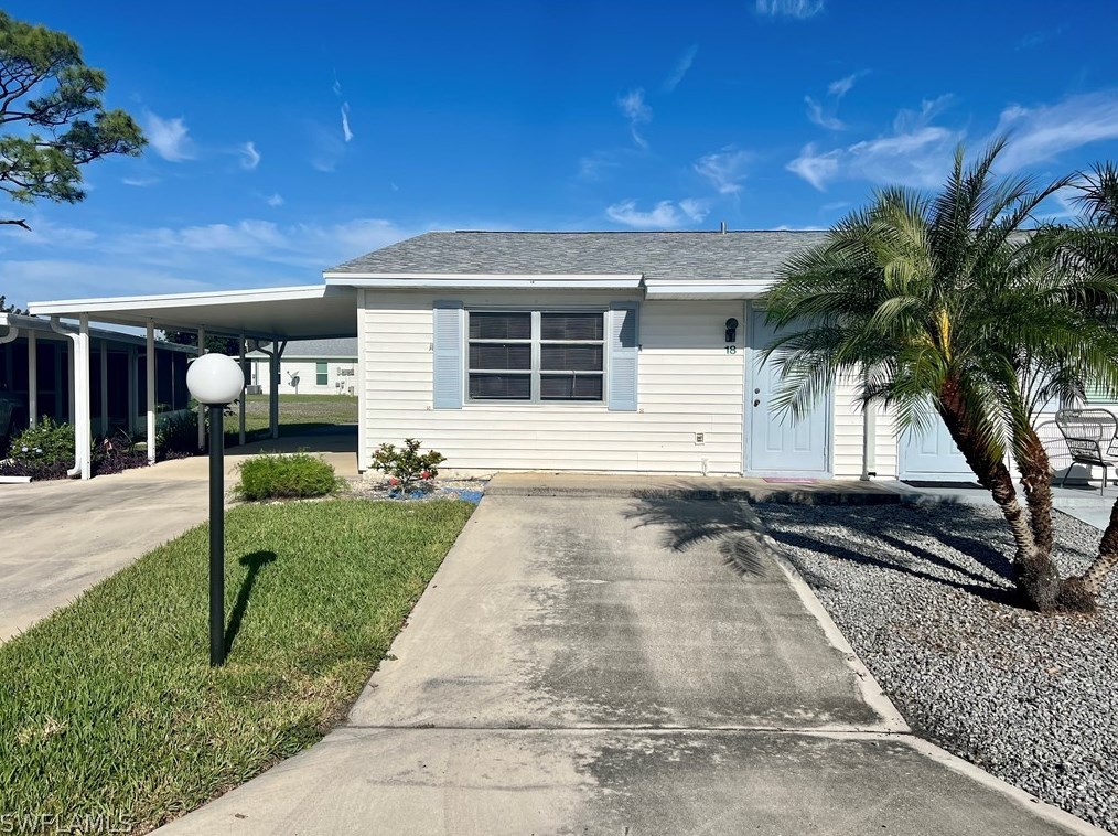 18 Pinewood Blvd, Lehigh Acres FL  33936-7304 exterior
