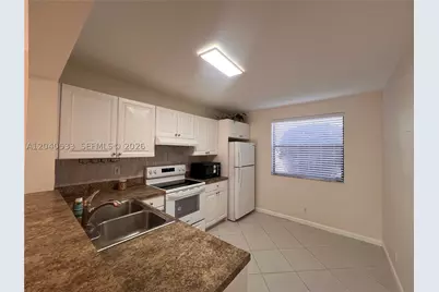5661 Riverside #101B7, Coral Springs, FL 33067 - Photo 9