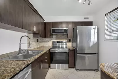 3041 N Oakland Forest Drive #103, Oakland Park, FL 33309 - Photo 3