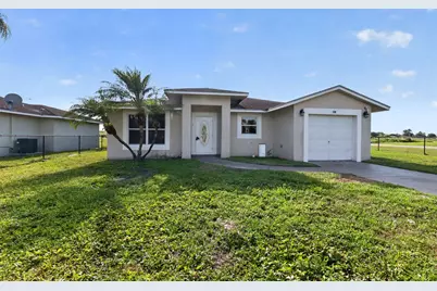 138 Dabou Loop, Belle Glade, FL 33430 - Photo 1
