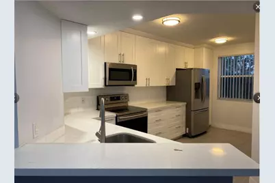 9055 Wiles Road #307, Coral Springs, FL 33067 - Photo 3