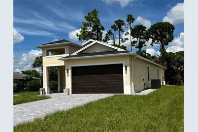 879 Sunrise Boulevard, Lehigh Acres, FL 33974 - Photo 1