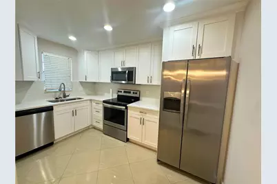 2420 Deer Creek Country Club Boulevard #306, Deerfield Beach, FL 33442 - Photo 1