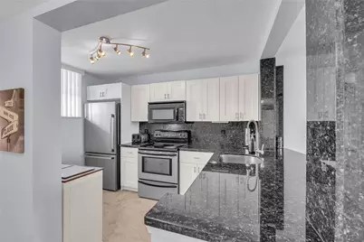 112 Lake Emerald Drive #104, Oakland Park, FL 33309 - Photo 5