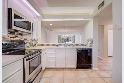 2441 Village Boulevard #102, West Palm Beach, FL 33409 - Photo 1