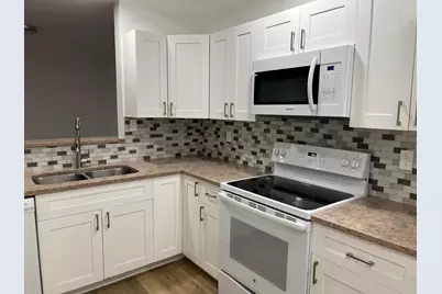 11241 W Atlantic Boulevard #201, Coral Springs, FL 33071 - Photo 1