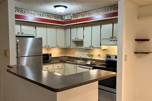 9702 S Belfort Cir, Tamarac, FL 33321 - Photo 1