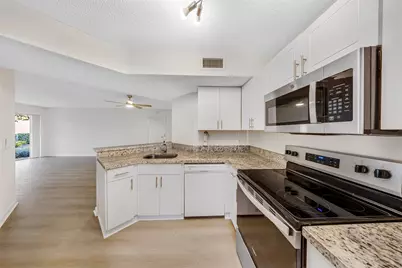 8977 Wiles Road #102, Coral Springs, FL 33067 - Photo 1