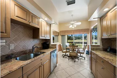 5590 Golf Pointe Drive #5590, Sarasota, FL 34243 - Photo 3