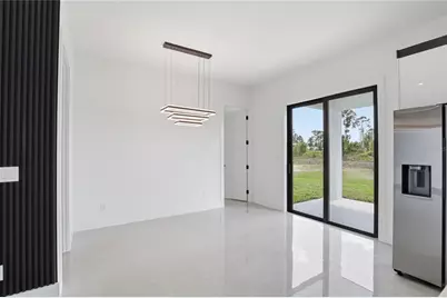 1124 S Edelweiss Street E, Lehigh Acres, FL 33974 - Photo 7