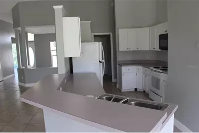 6812 Sassanon Court, Orlando, FL 32818 - Photo 13