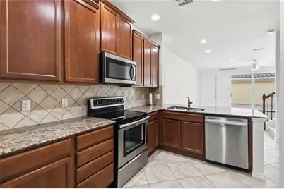 8681 Lower Villagewalk Circle, Orlando, FL 32827 - Photo 23