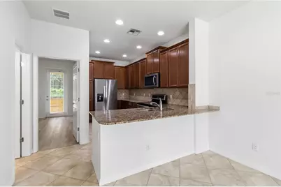 8681 Lower Villagewalk Circle, Orlando, FL 32827 - Photo 21