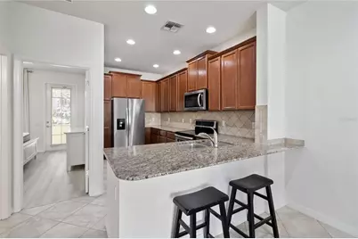 8681 Lower Villagewalk Circle, Orlando, FL 32827 - Photo 19