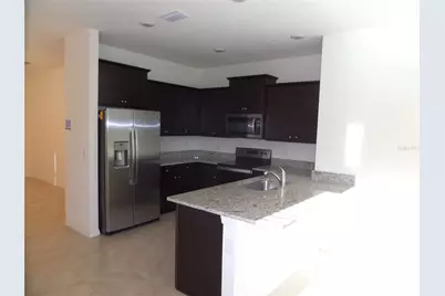 8051 Penrose Place, Wildwood, FL 34785 - Photo 7