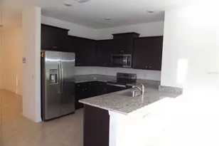 8051 Penrose Pl, Wildwood, FL 34785 - Photo 7