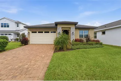 7669 Five Oaks Drive, Harmony, FL 34773 - Photo 1