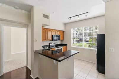 2558 Robert Trent Jones Drive #1410, Orlando, FL 32835 - Photo 7