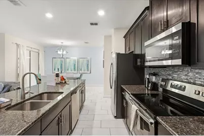 9075 Dogleg Dr, Champions Gate, FL 33896 - Photo 9