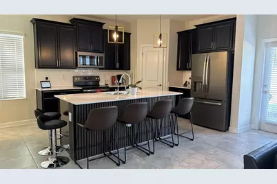 1055 Blackwolf Run Road, Champions Gate, FL 33896 - Photo 5