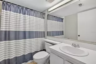 1225 Pine Ridge Cir W, Tarpon Springs, FL 34688 - Photo 19