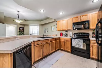 1827 Hammocks Avenue #1827, Lutz, FL 33549 - Photo 5