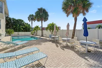 10399 Paradise Boulevard #107, Treasure Island, FL 33706 - Photo 21