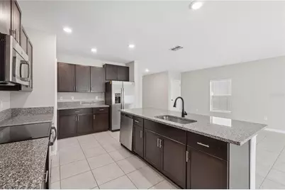 7207 Ronnie Gardens Court, Tampa, FL 33619 - Photo 9