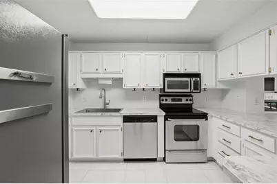 1200 Tarpon Woods Boulevard #Q4, Palm Harbor, FL 34685 - Photo 5