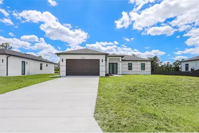 1122 S Edelweiss Street E, Lehigh Acres, FL 33974 - Photo 1