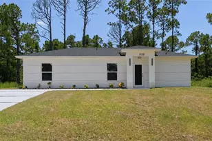 1120 Ravenswood St E, Lehigh Acres, FL 33974 - Photo 1