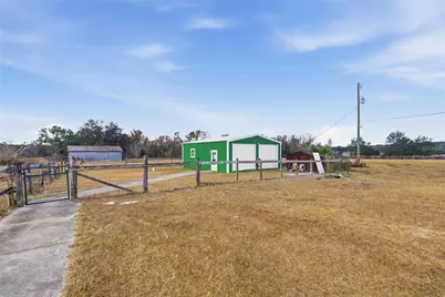 9900 SE Sunset Harbor Road, Summerfield, FL 34491 - Photo 1