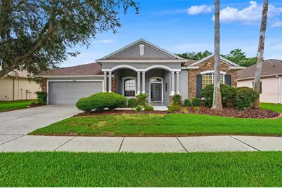 7504 Whispering Wind Drive, Land O Lakes, FL 34637 - Photo 1