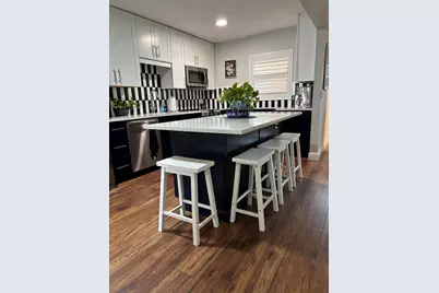 12009 Poinciana Boulevard #101, Royal Palm Beach, FL 33411 - Photo 1