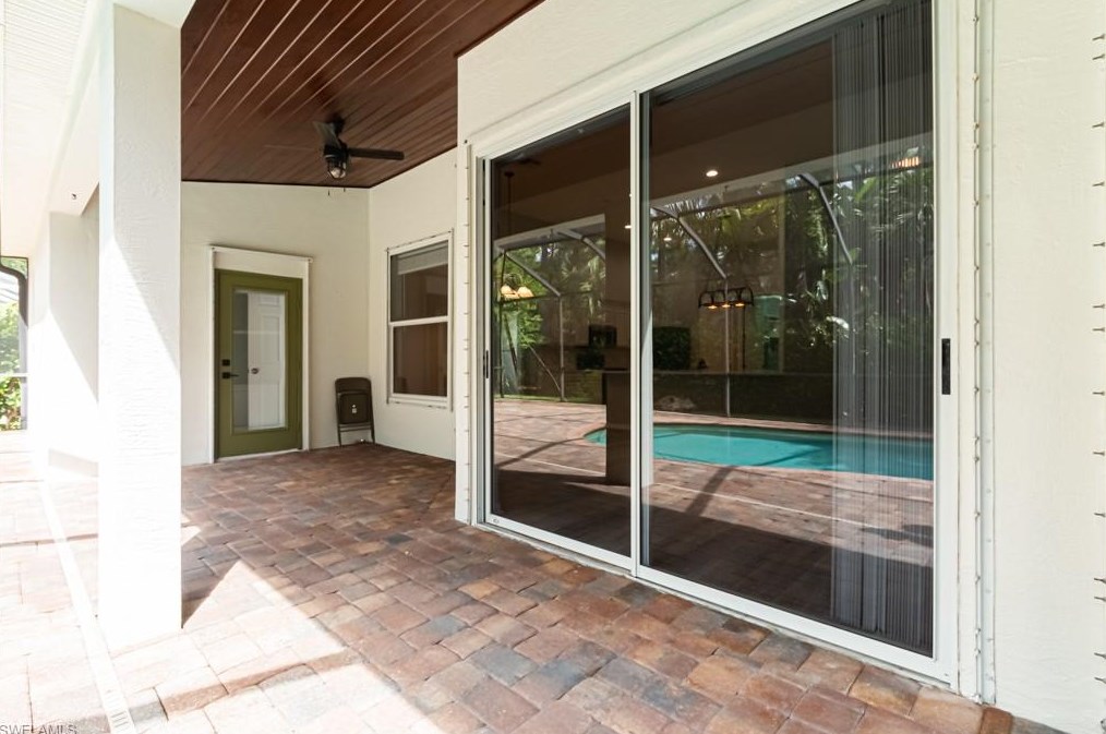 303 Burnt Pne Dr, Naples FL 34119-9773 exterior