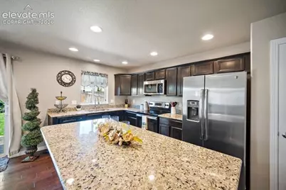 10061 Thunderbolt Trail, Colorado Springs, CO 80925 - Photo 11