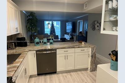 410 Golden Isles Dr #202, Hallandale Beach, FL 33009 - Photo 9