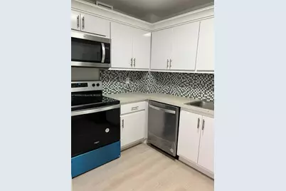 401 Golden Isles Dr #303, Hallandale Beach, FL 33009 - Photo 5